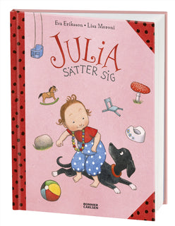 Julia sätter sig